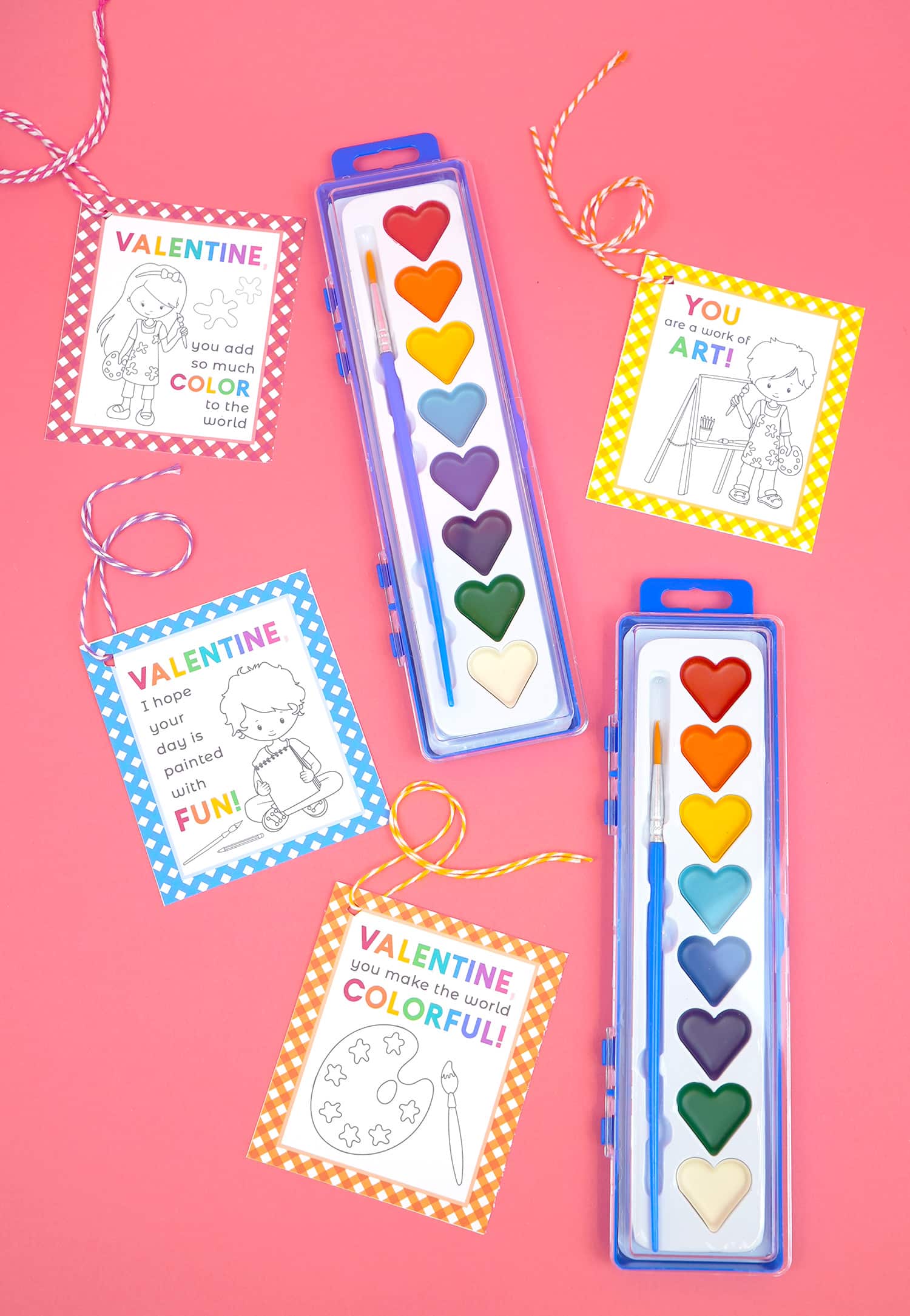 heart-shaped watercolor paints with cute printable paint valentines on a pink background