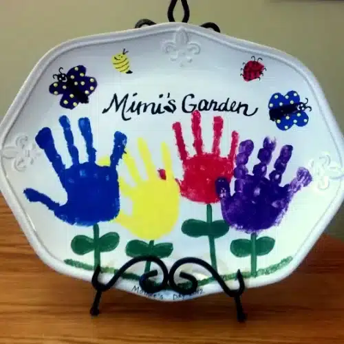 colorful handprints on ceramic platter