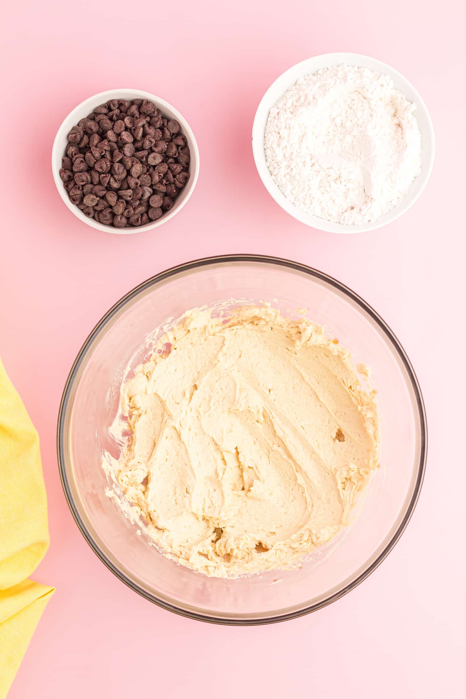 Chocolate chip cookie cake recipe ingredients being combined in mixing bowl