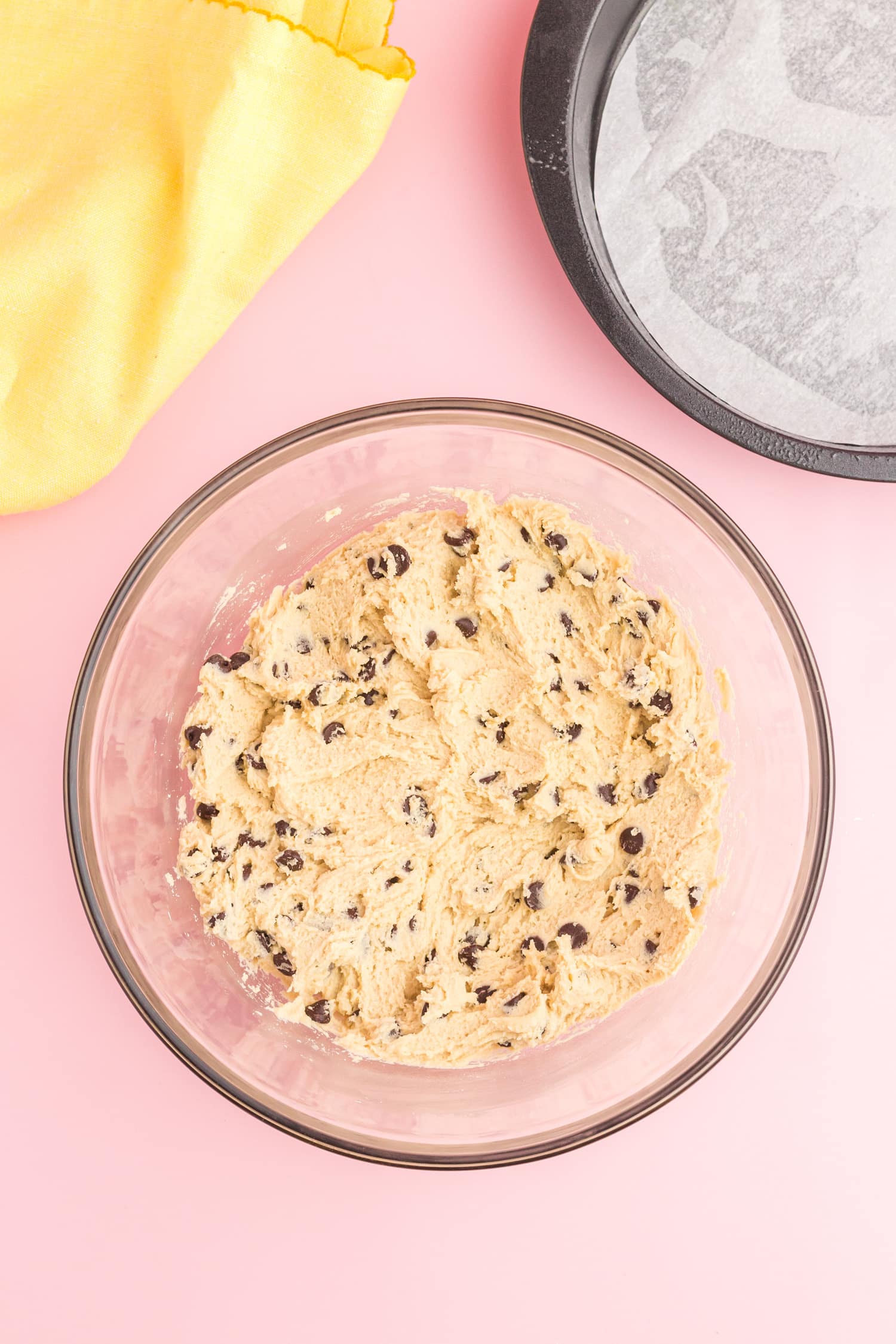 Chocolate chips added to mixture for cookie cake recipe