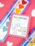 Heart-shaped watercolor paint set with a "Valentine, You Add So Much Color to the World" printable paint valentine card for kids