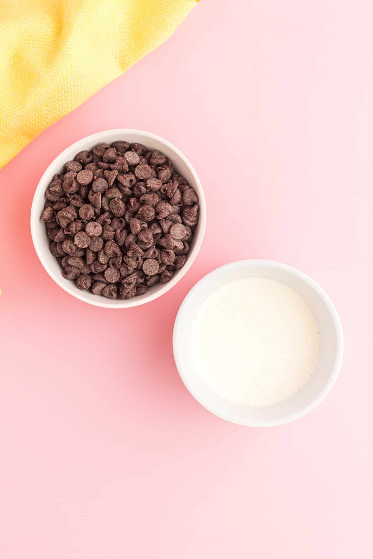 bowl of chocolate chips and bowl of cream