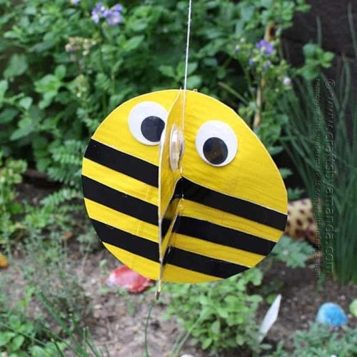 Bumble bee made from duct tape hanging in garden