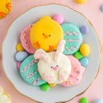 easter oreos decorated like chicks, bunnies, easter eggs, on plate with easter decor