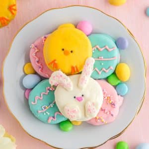 easter oreos decorated like chicks, bunnies, easter eggs, on plate with easter decor