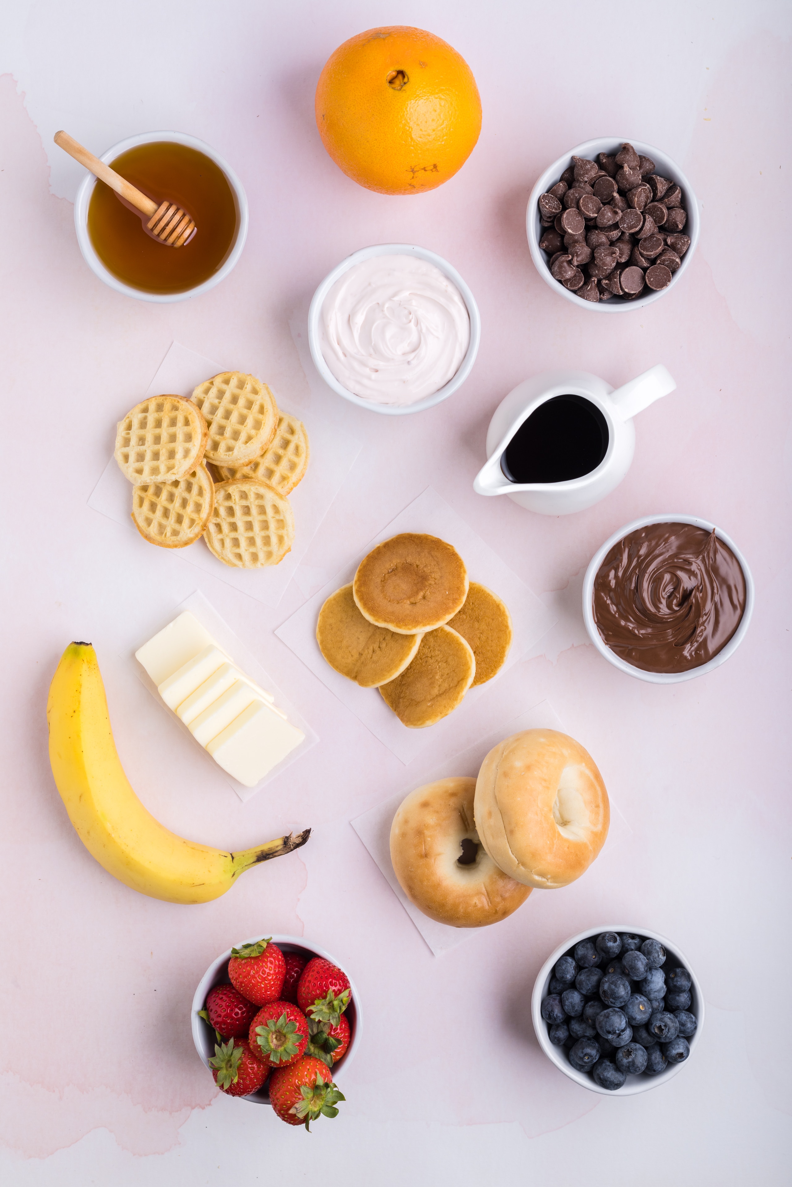 Individual ingredients needed for Breakfast Charcuterie Board assembly laid out