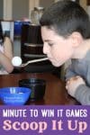 Child playing Minute to Win It Game 'Scoop It Up'