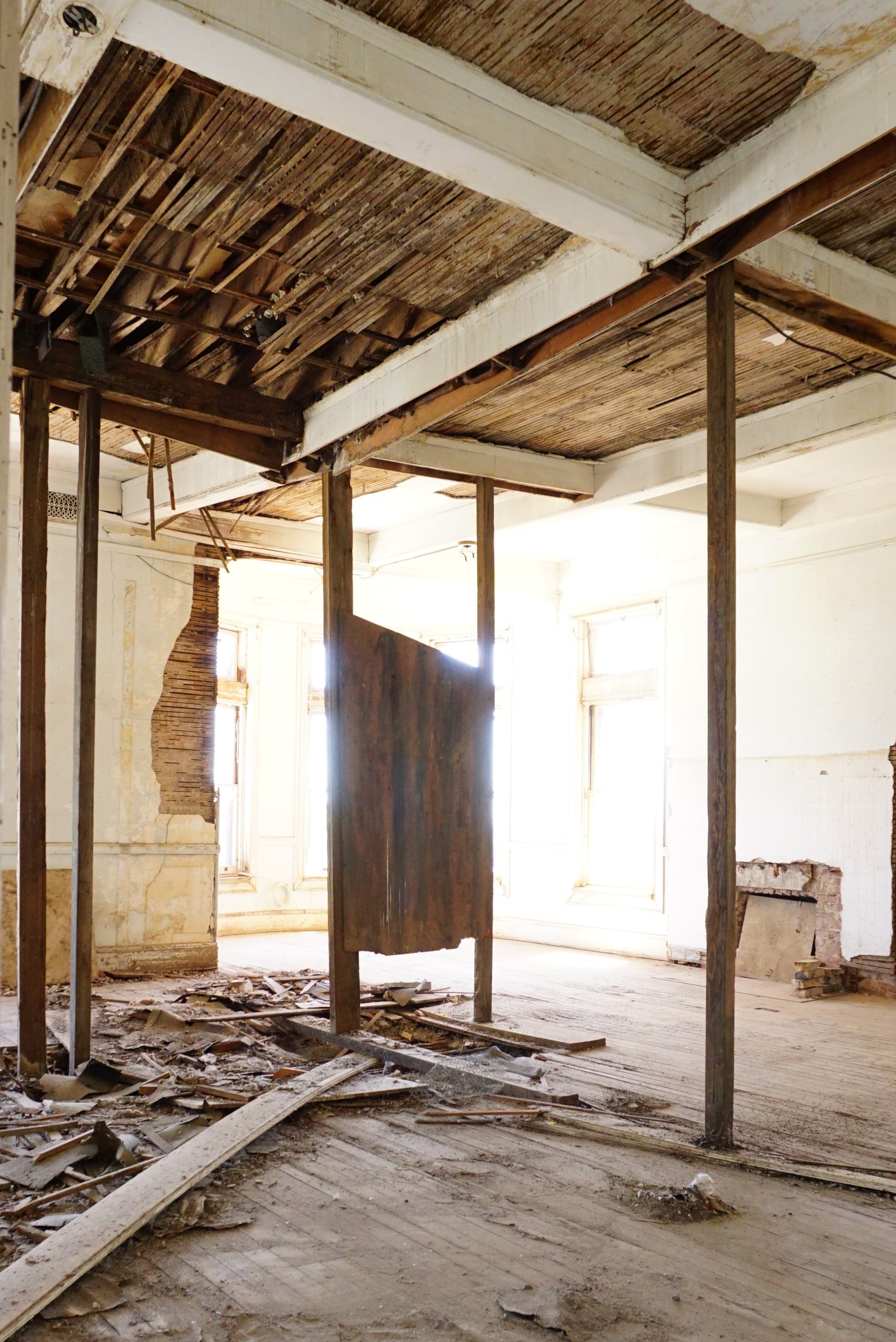 apartment room in ruins with sunlight streaming in