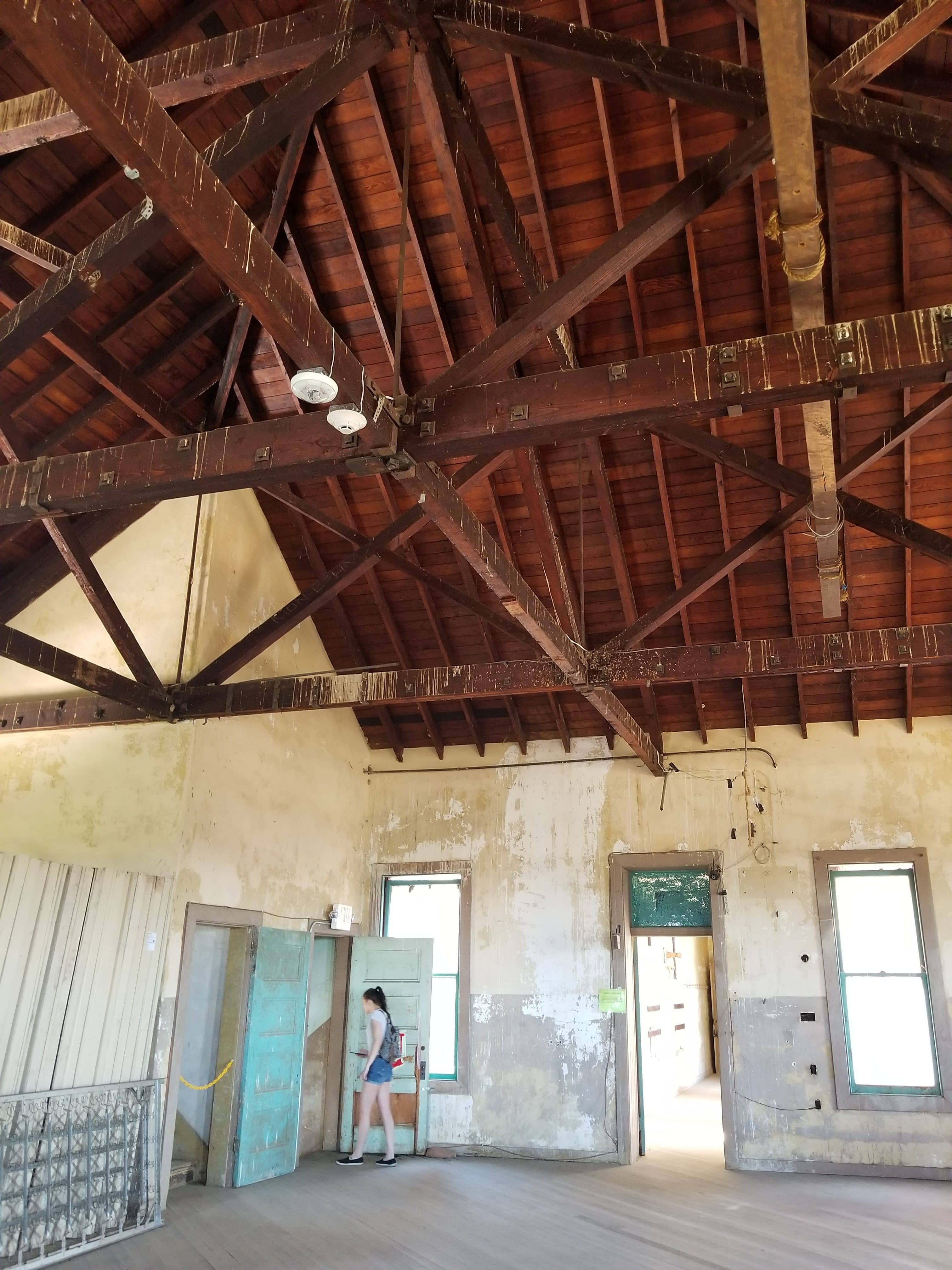 intricate beam and rafter system above the dormitory floor