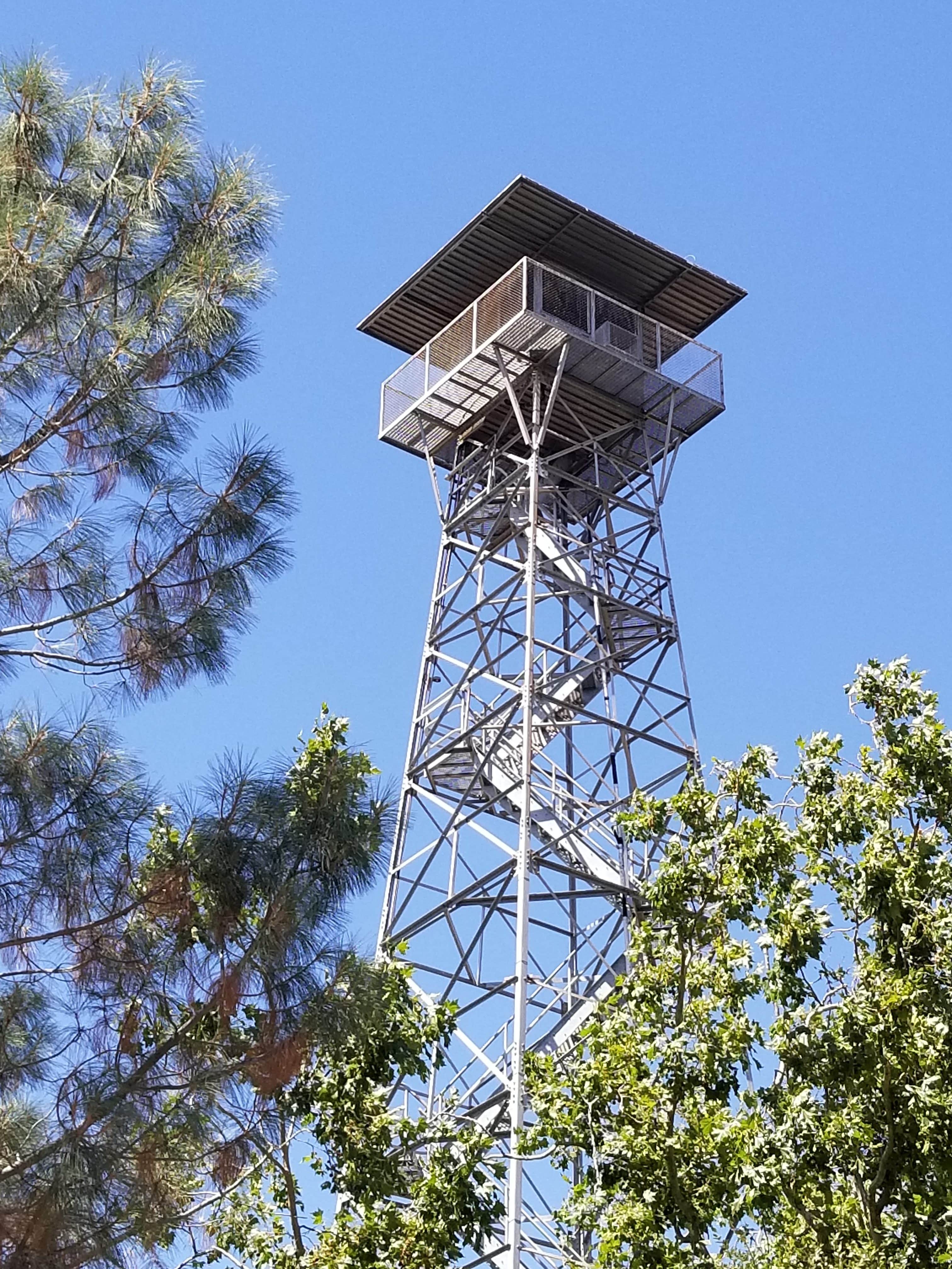 guard tower at Preston Castle surrounded by trees and clear blue sky