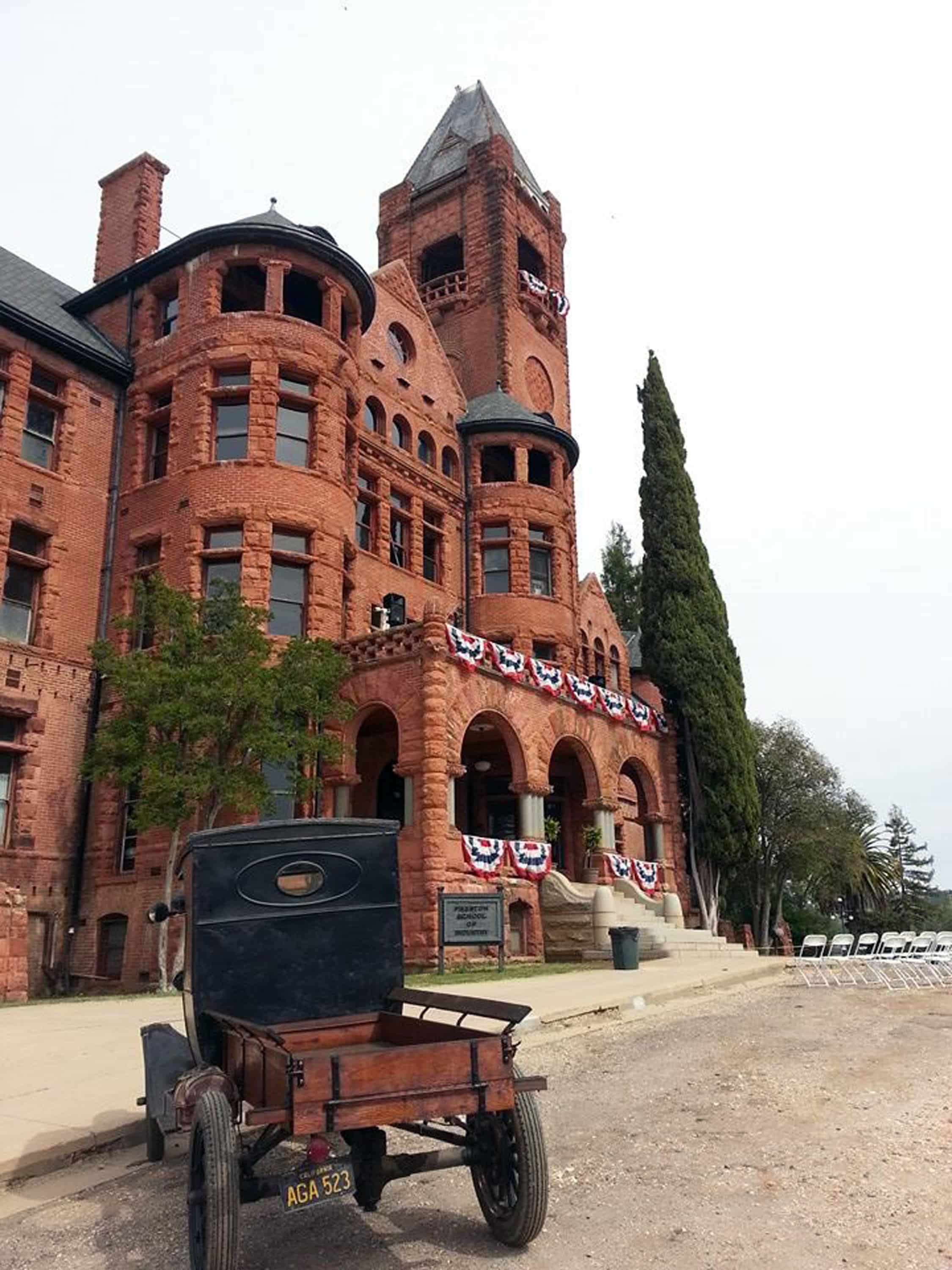 Antique car in front of Preston Castle which has been adorned with patriotic buntings for 4th of July