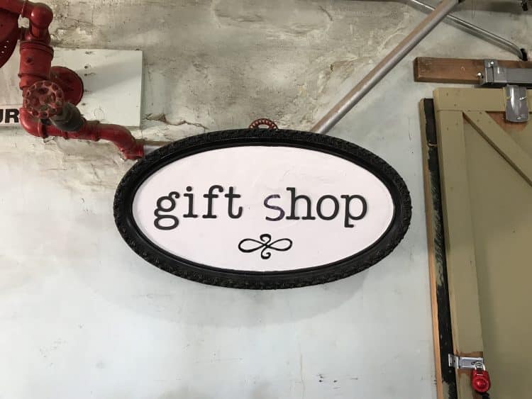oval sign that reads "gift shop"