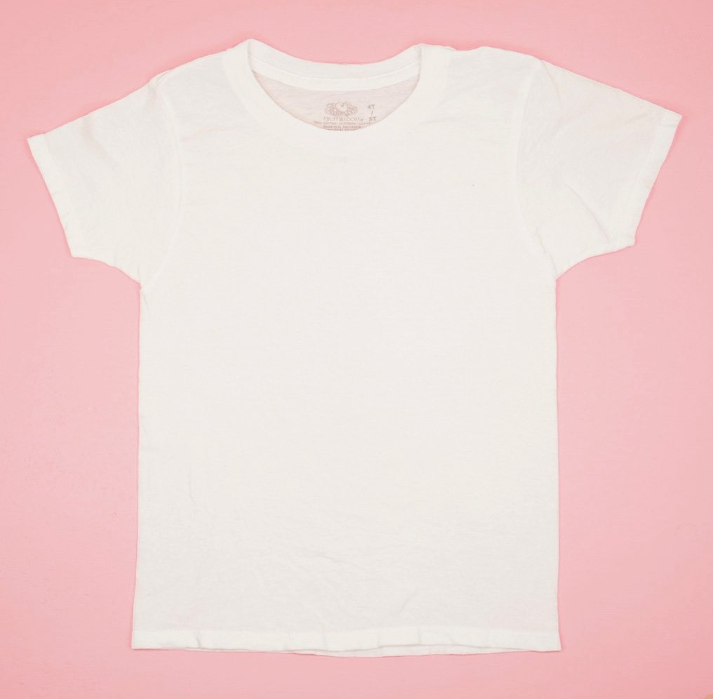 plain white t-shirt laid flat on pink background