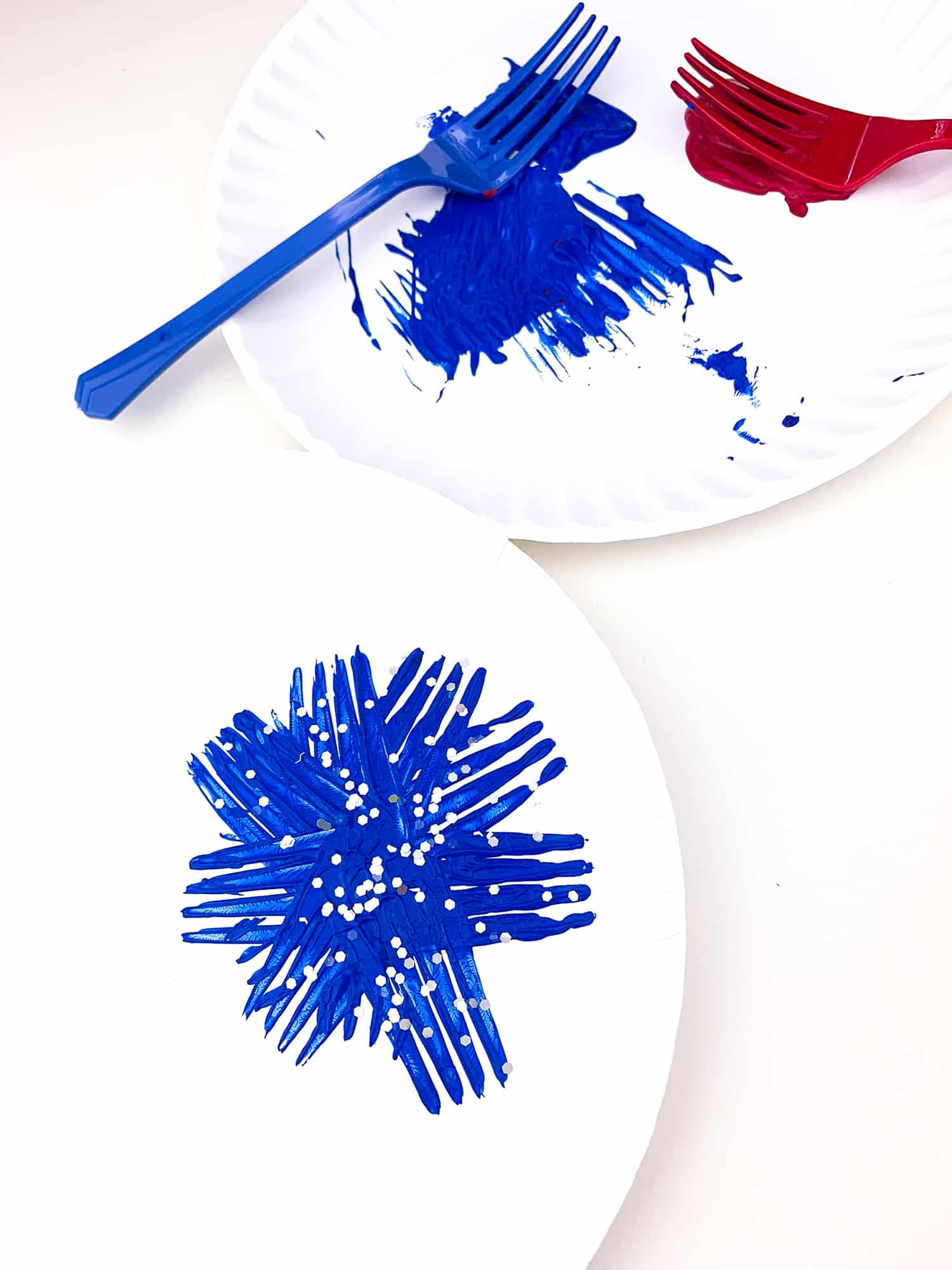 finished blue firework on paper plate