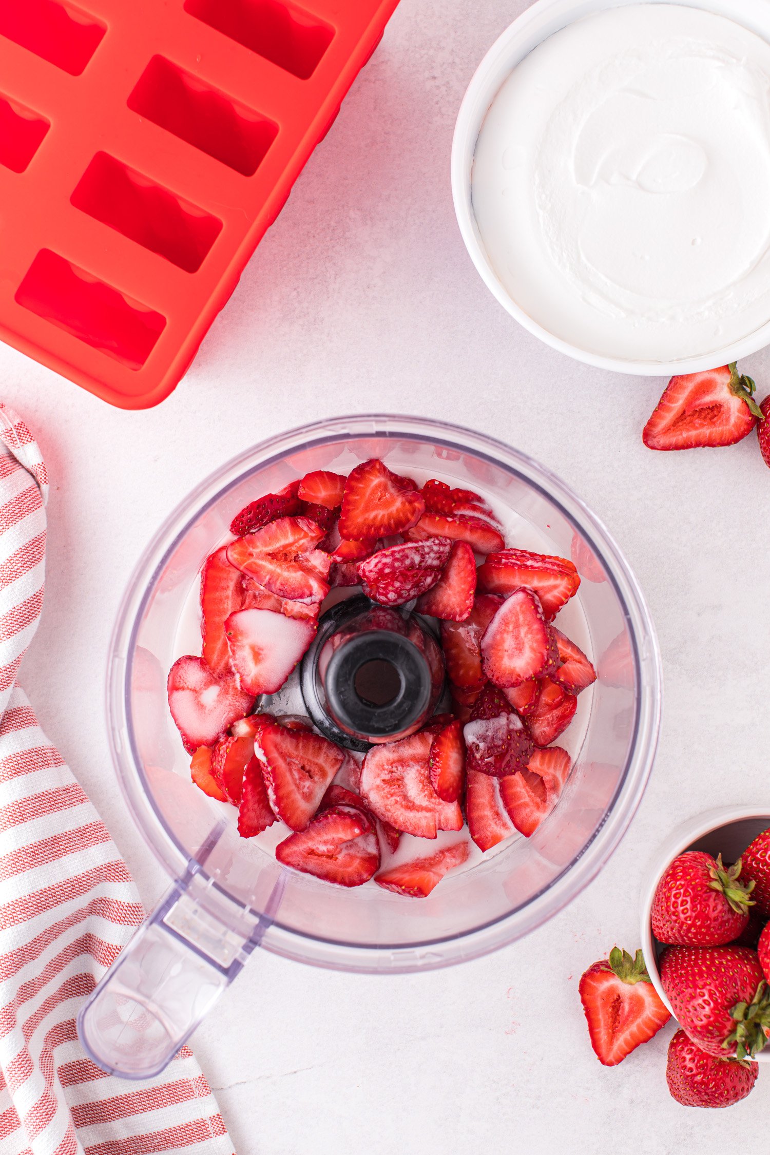 strawberries sliced in halves and added to blender