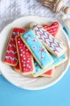 plate of frosted sugar cookies