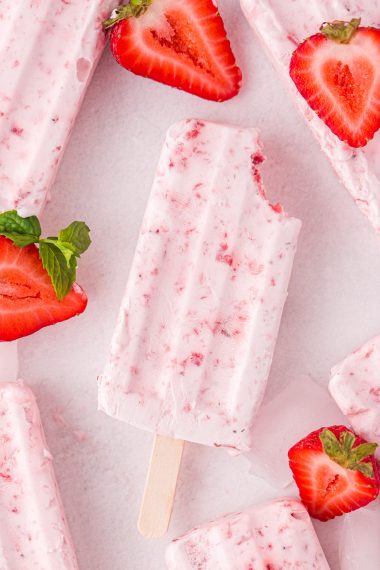 frozen fruit popsicle with bite out of it