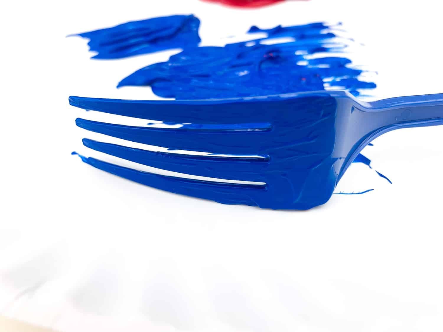blue fork mark on paper plate beginning firework craft for kids