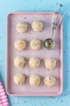 yummy cold treats on baking sheet with scoop