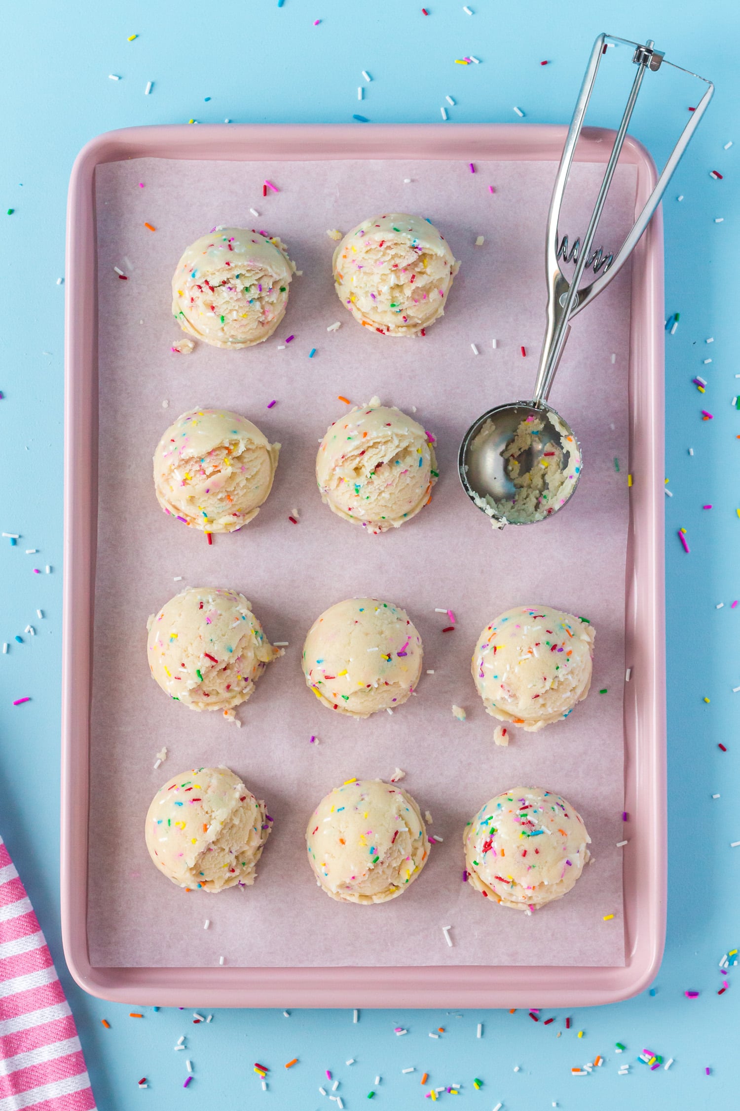 yummy cold treats on baking sheet with scoop