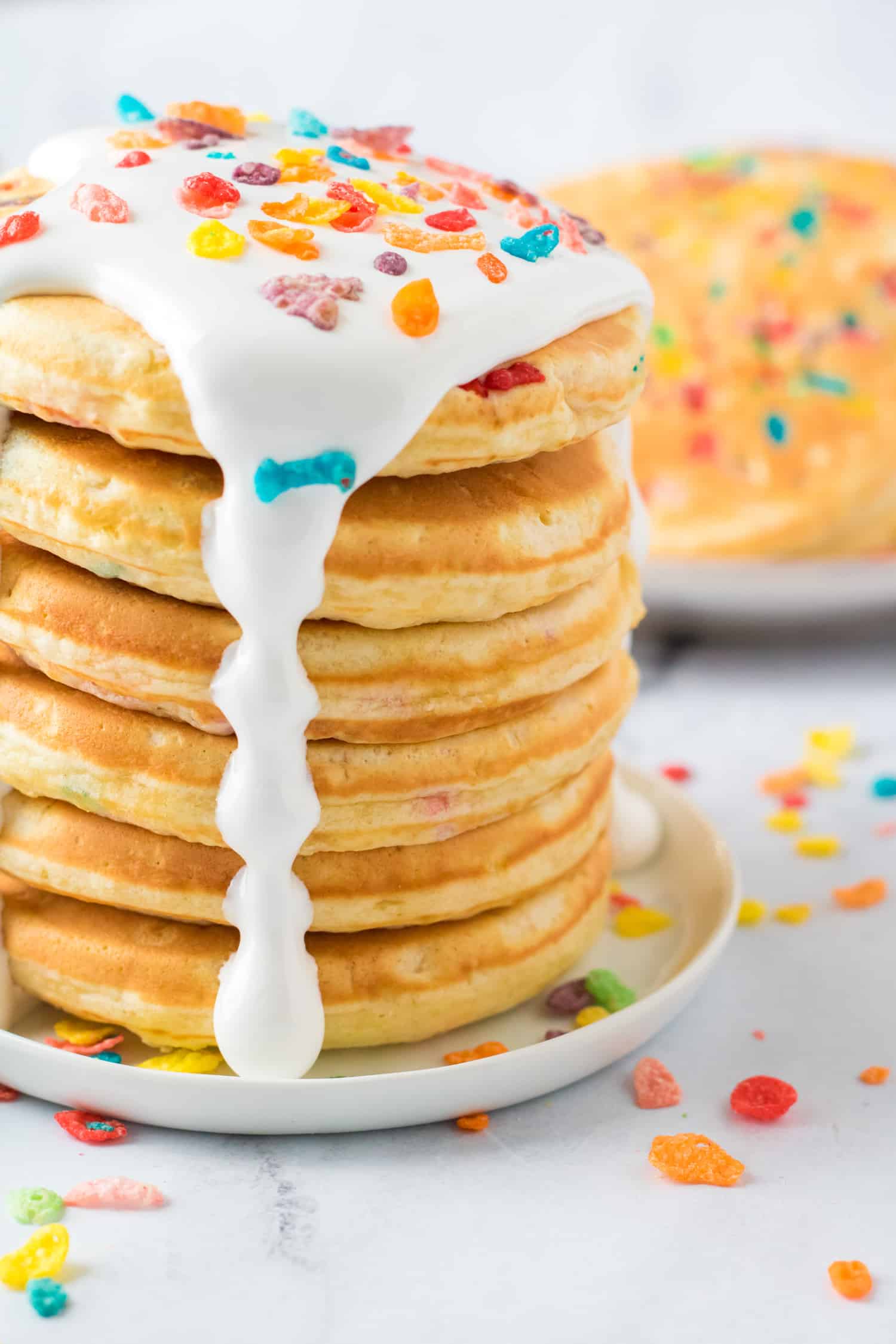 stack of fluffy pancakes with icing