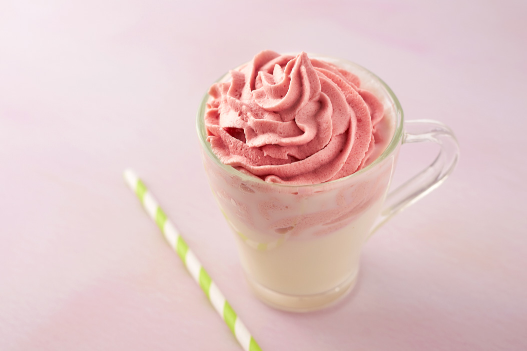 tasty strawberry milk with straw