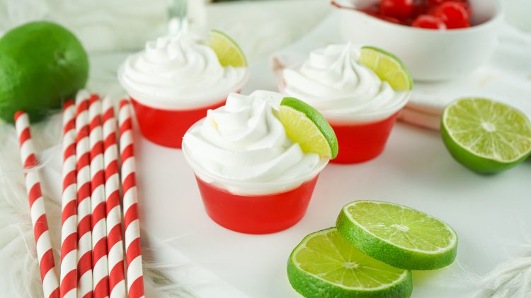 set of jello shots with lime wedges