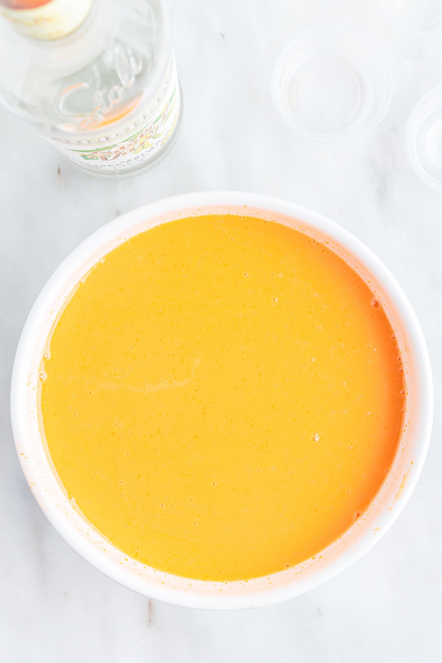orange jello mixture in bowl