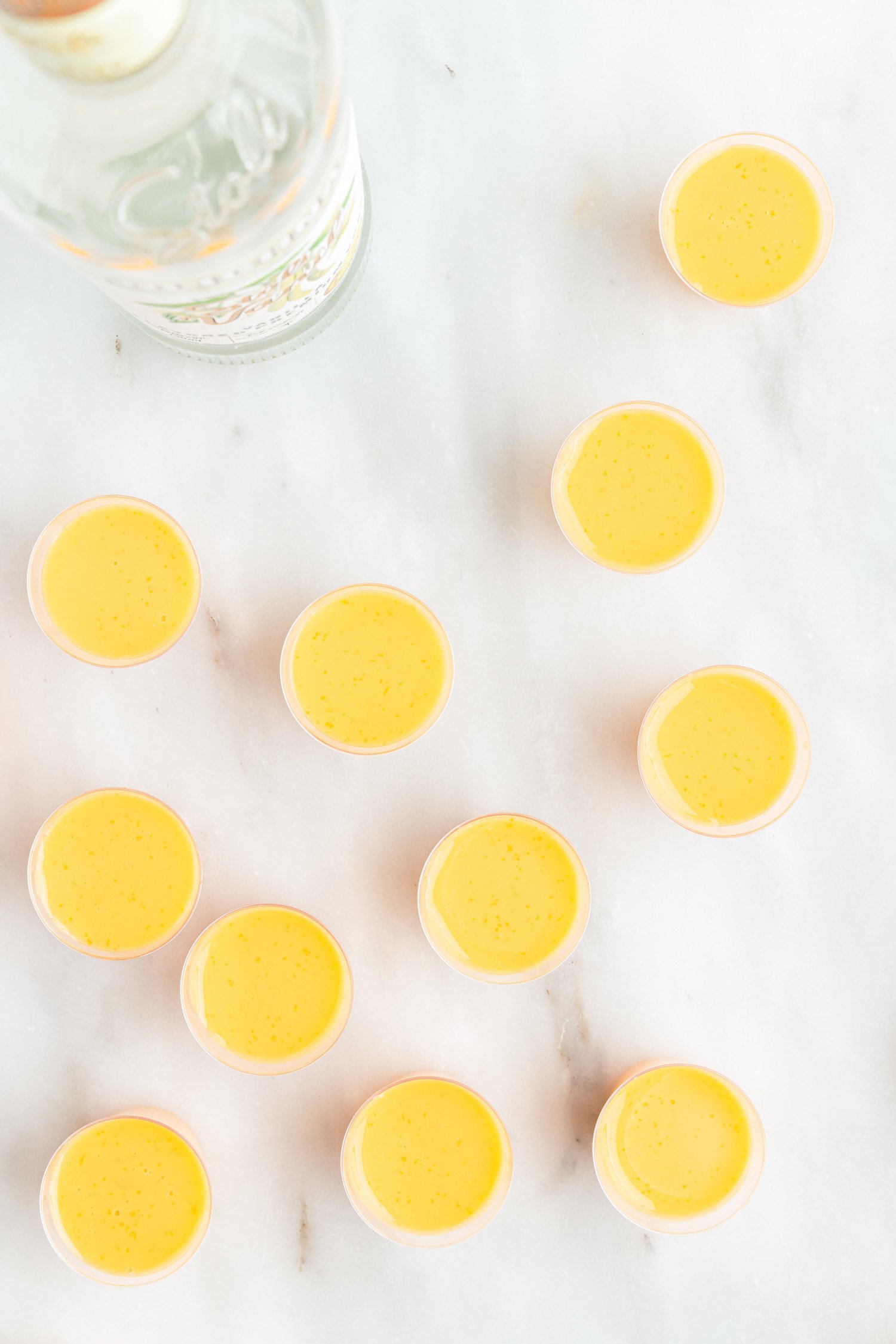 orange jello shots poured into cups