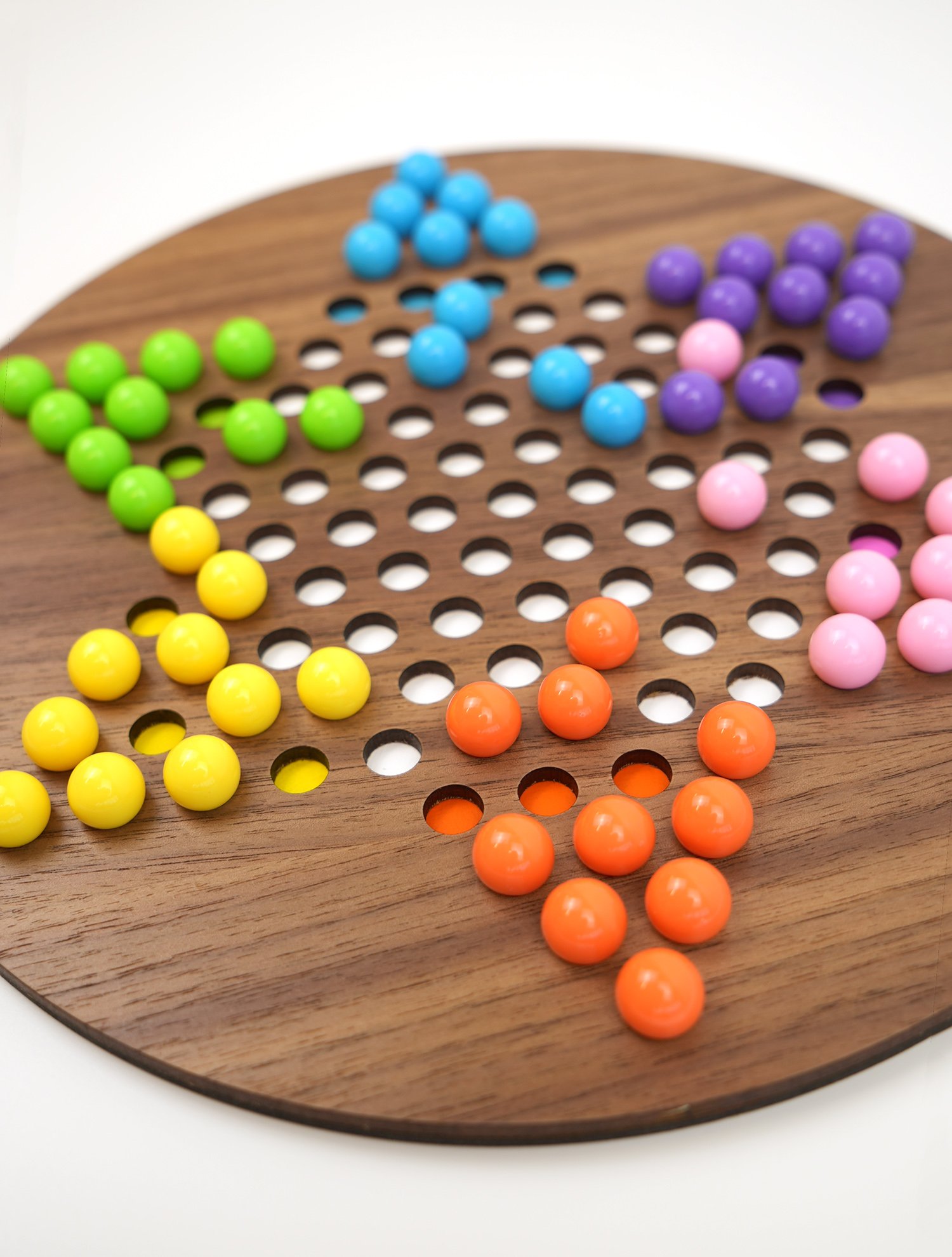 Close up of walnut wood Chinese checkers board cut with xTool P2