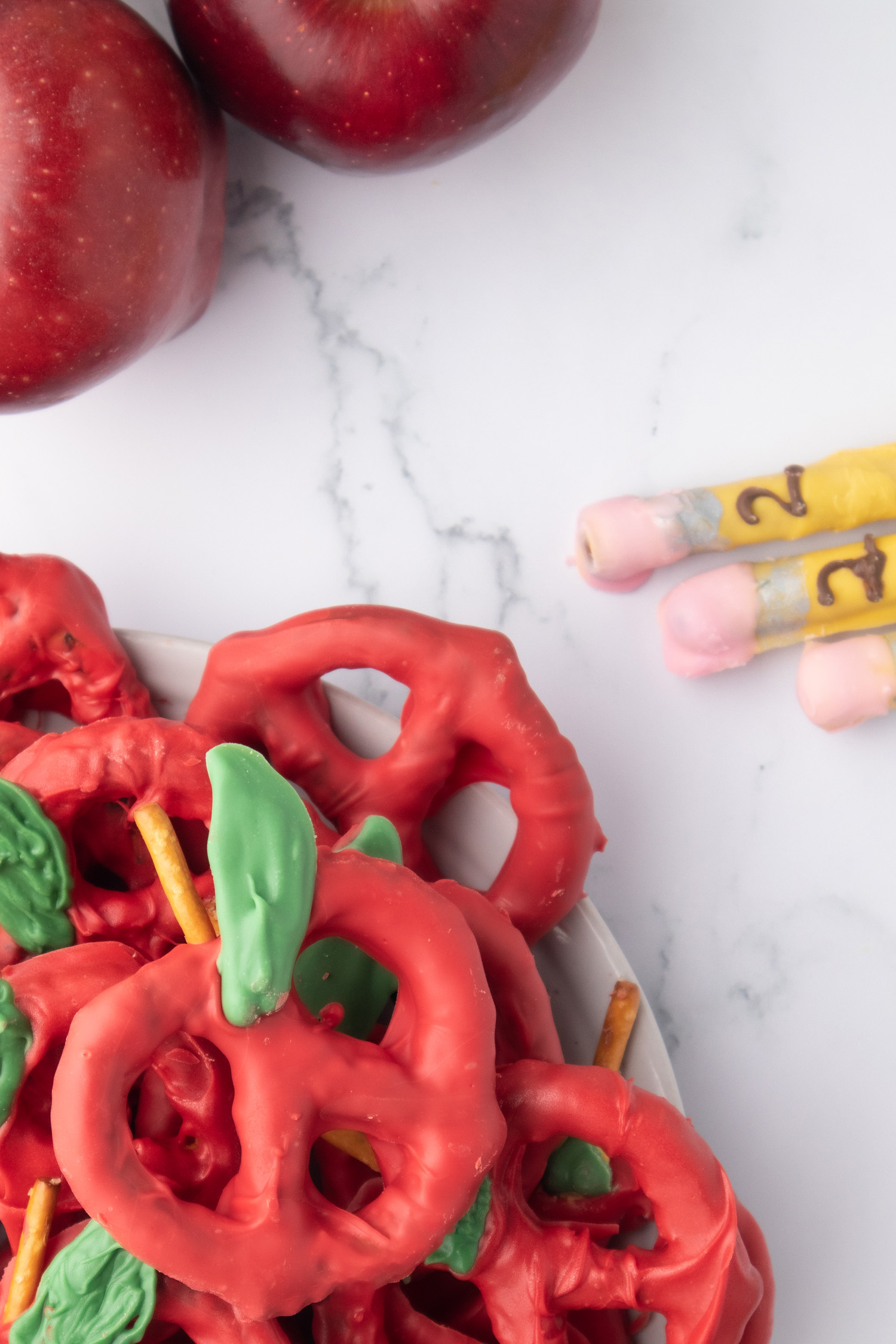 pencils and apples made from easy chocolate covered pretzel recipe