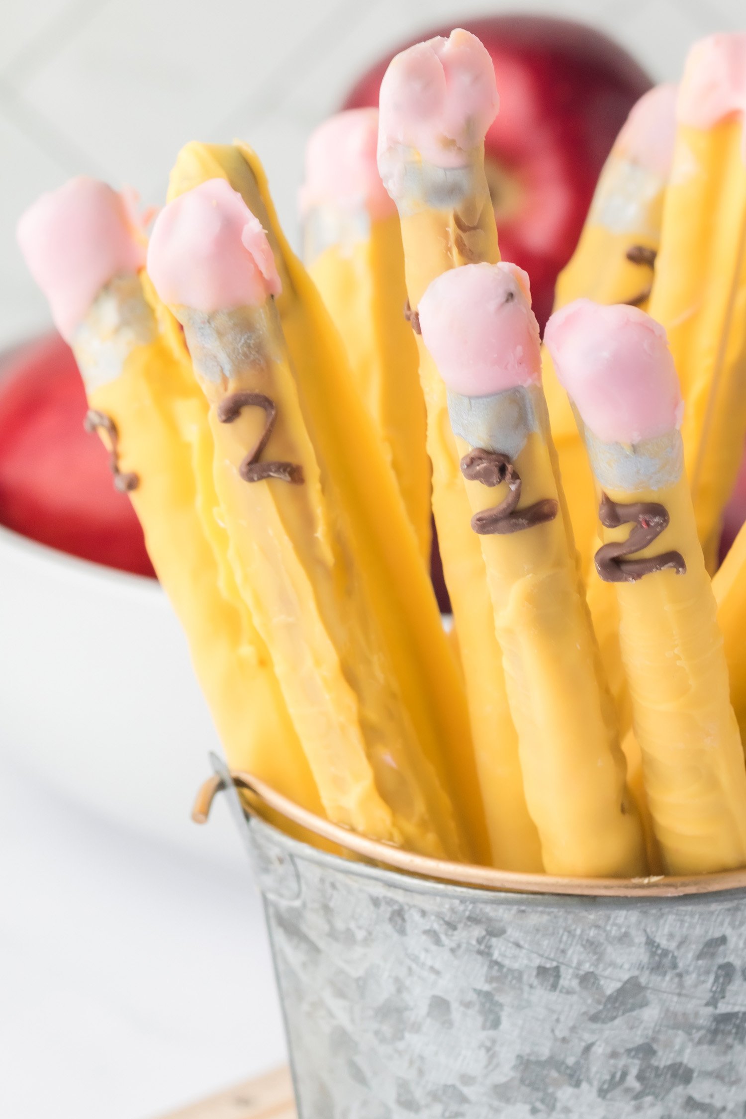 pretzels dipped in chocolate to look like pencils in tin can