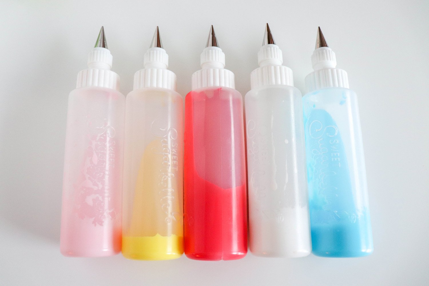 icing bottles filled with various colors