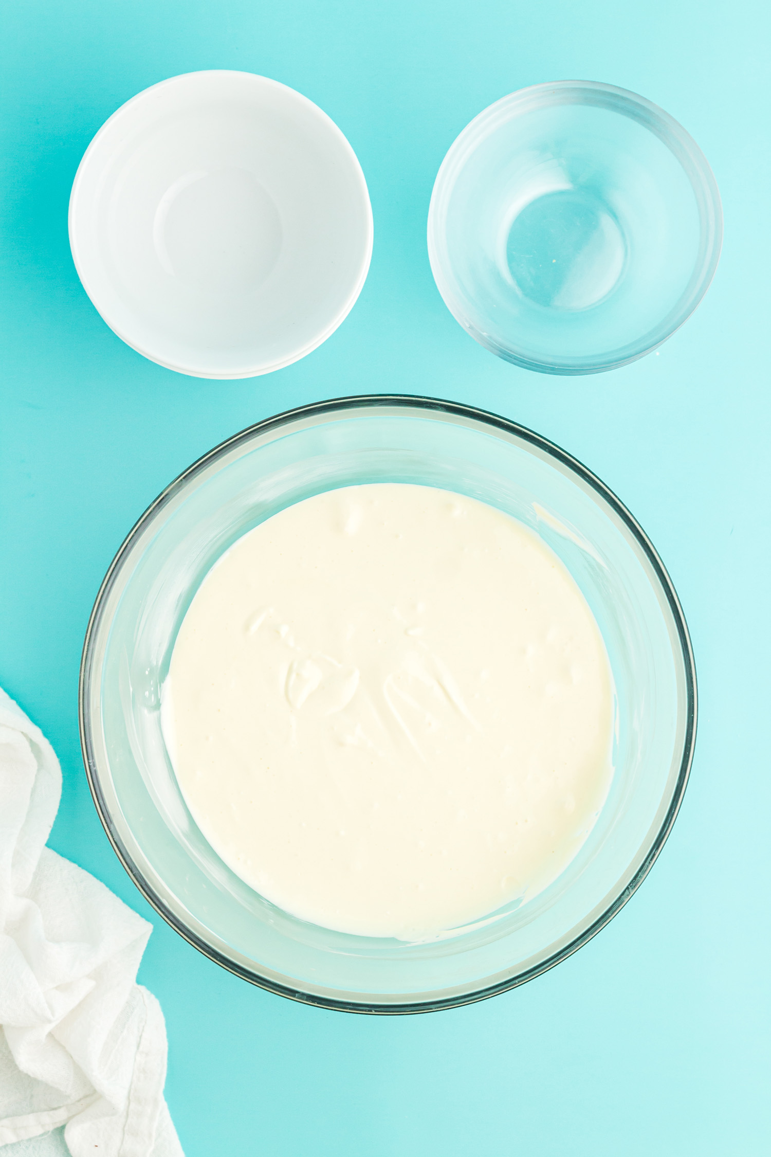 ingredients for colorful cheesecake in bowls