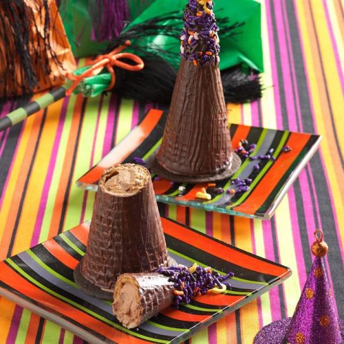 easy halloween dessert mousse filled witches hats on party table