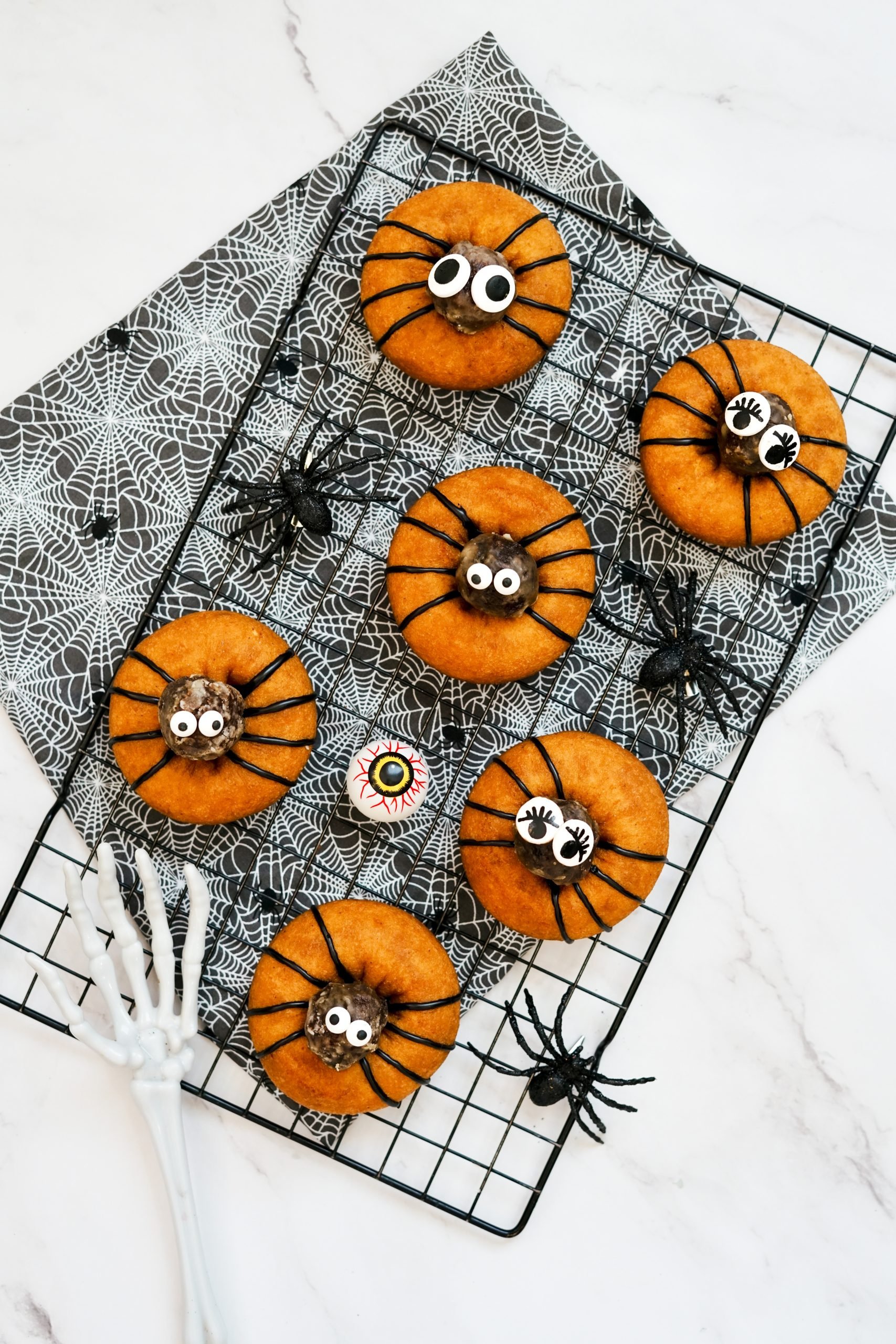 spooky spider donuts on tray with decor