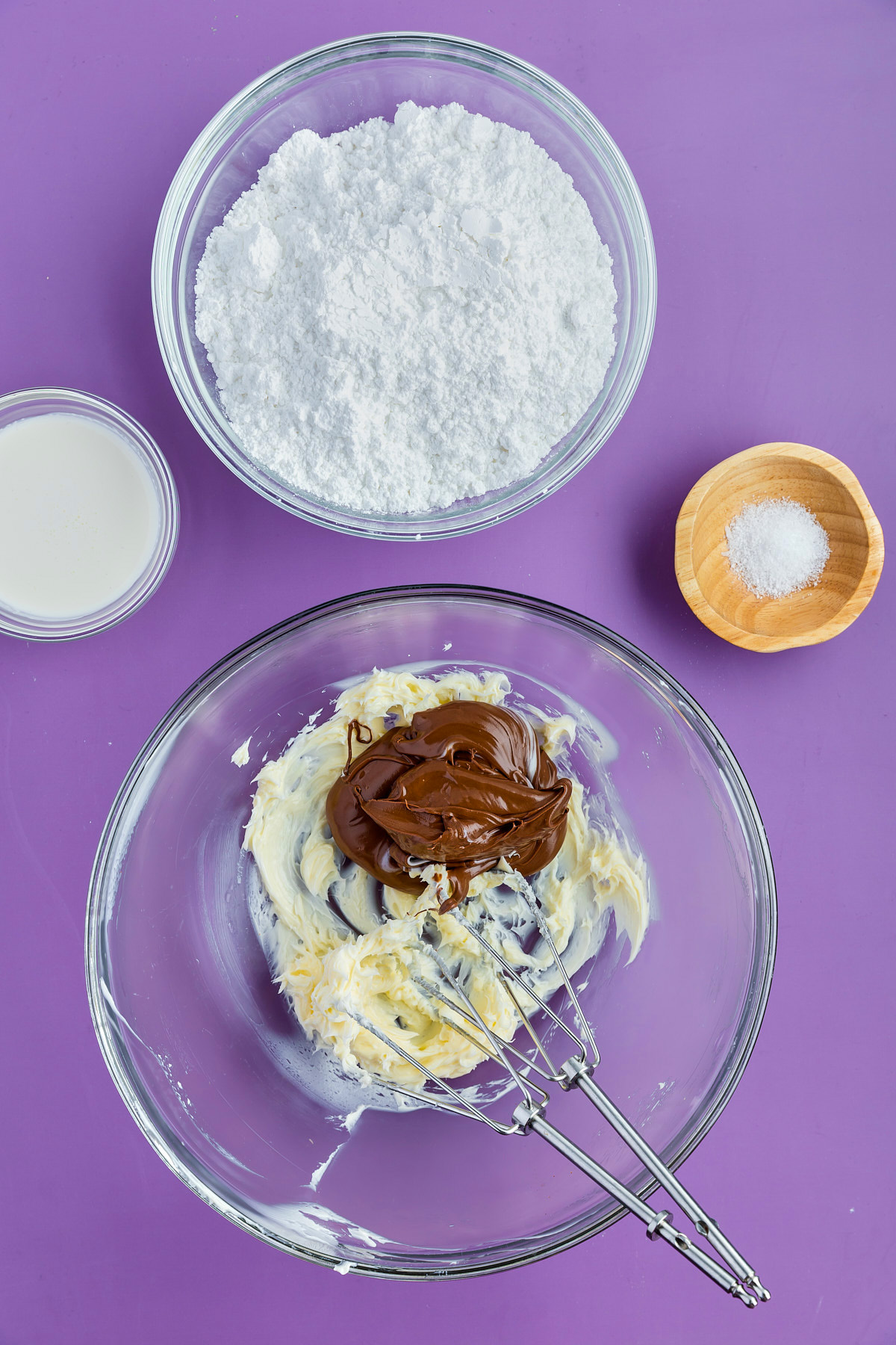 ingredients for macarons being combined in mixing bowl