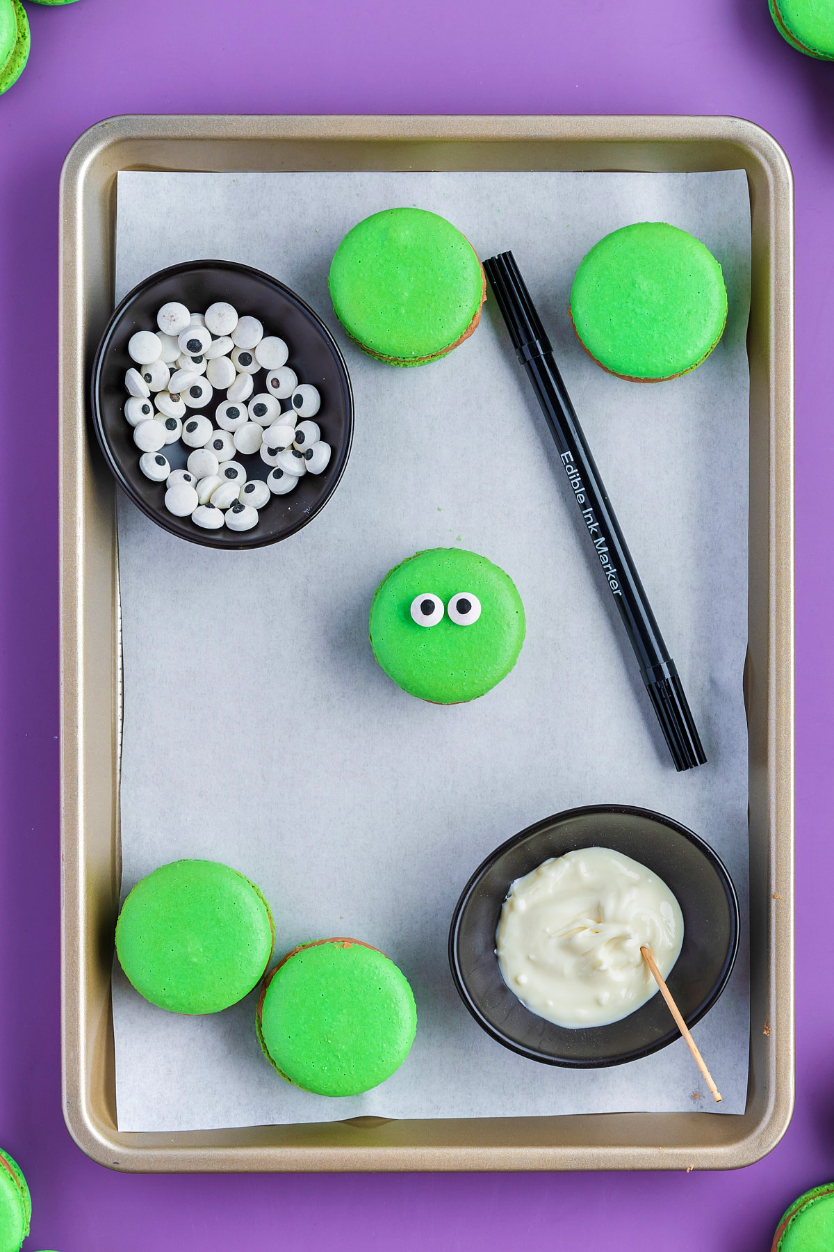 macaron cookies with decorating tools
