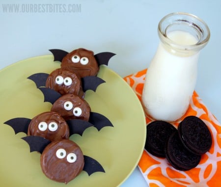 chocolate covered oreo bats with tall glass of milk