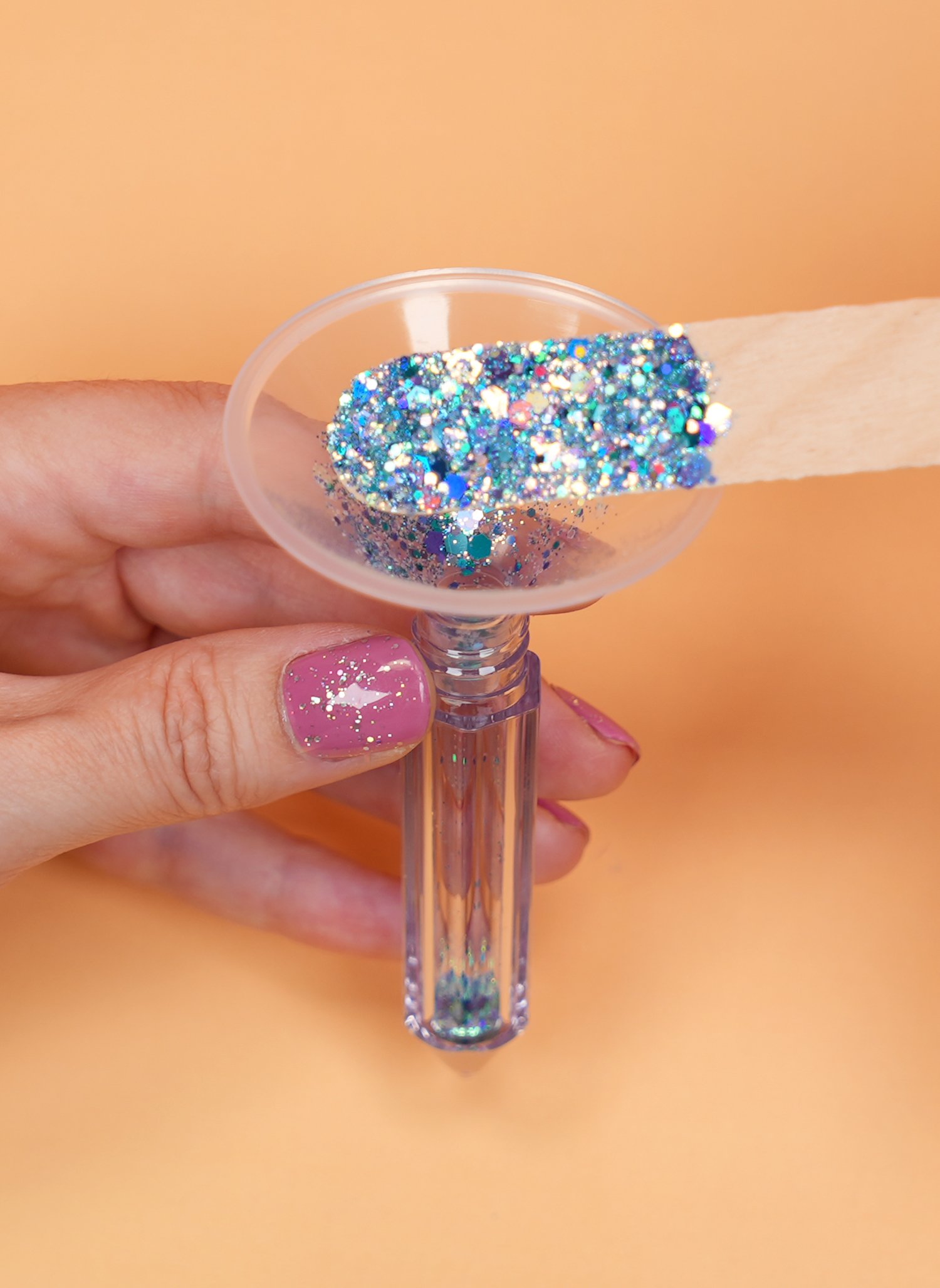 cone filter used to funnel glitter into keychain