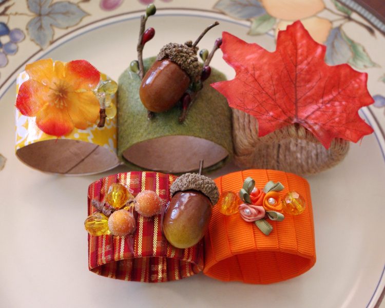 5 different colored handmade napkin rings on a plate