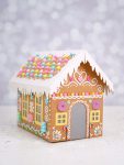 Cardboard gingerbread house with pastel rainbow faux candy decorations