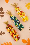 fall leaves and fall harvest corn in various colors