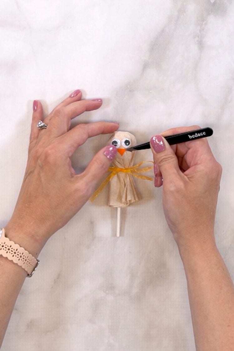 using tweezers to place waddle on turkey face