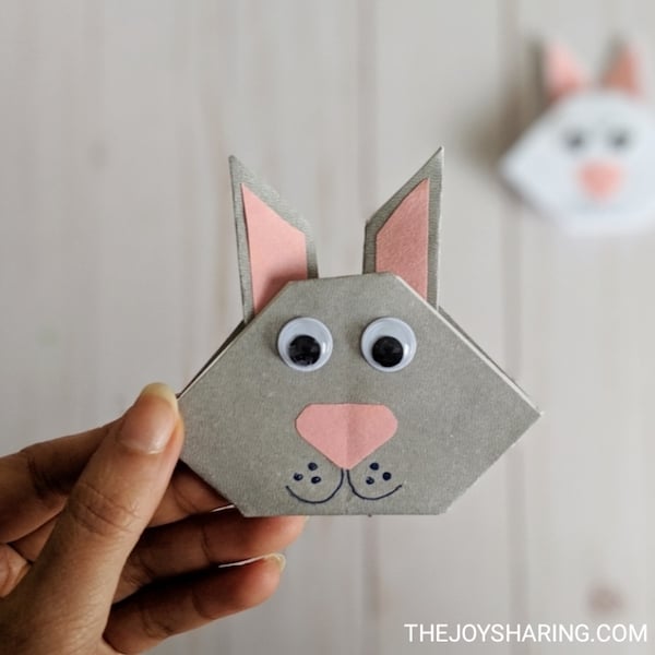 hand holding easy origami bunny kids can make