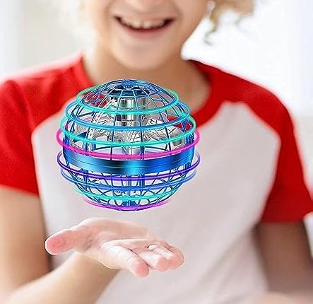 kids playing with galactic floating ball toy