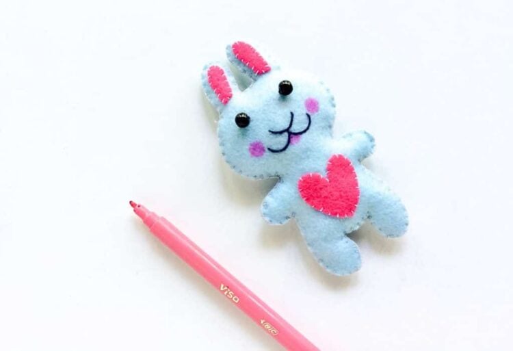 cute small bunny felt plushie with pink pen