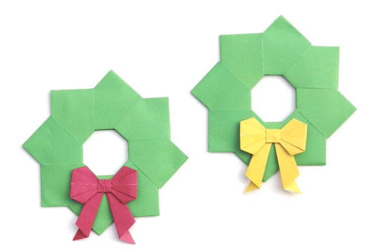 two christmas origami wreaths with colorful bows