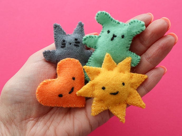 easy to sew pocket pal plushies in hand