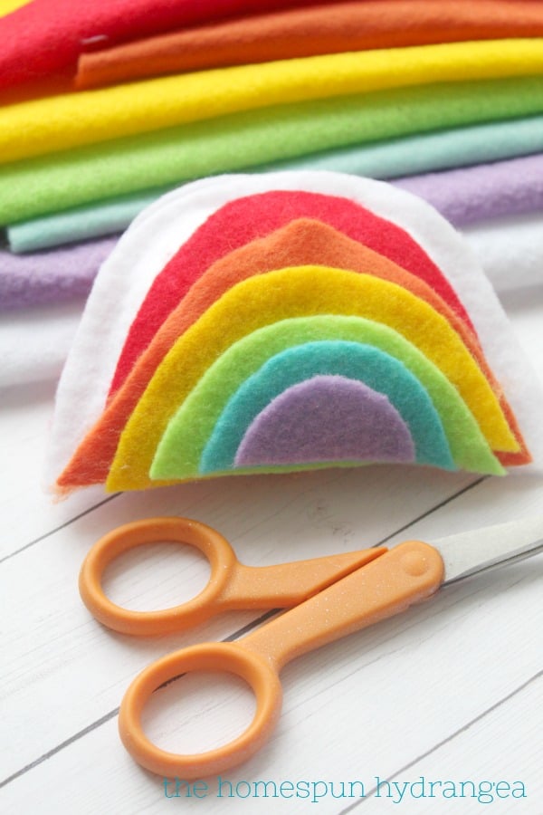 simple rainbow felt plushie kids can make with a pair of scissors